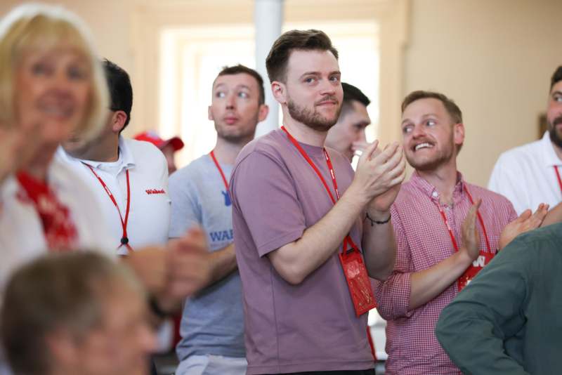 a group of people clapping