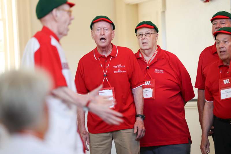 a group of men wearing matching outfits