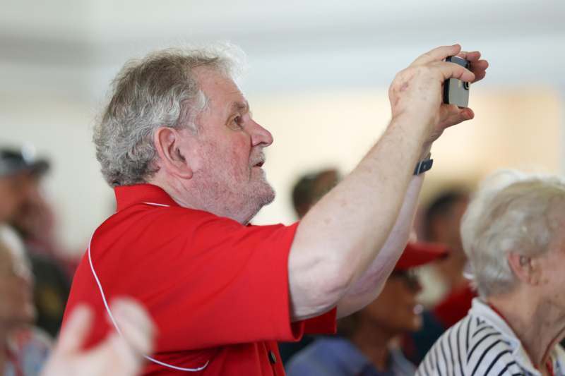 a man taking a picture of a group of people