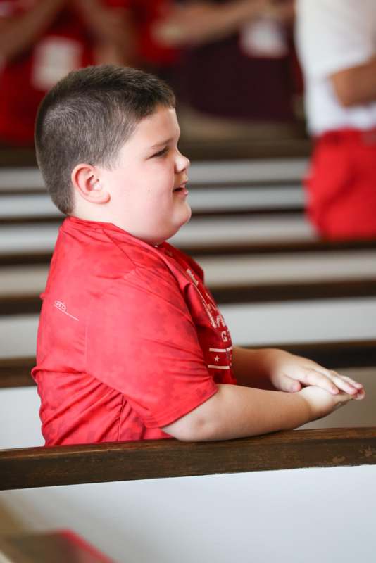 a boy in a red shirt