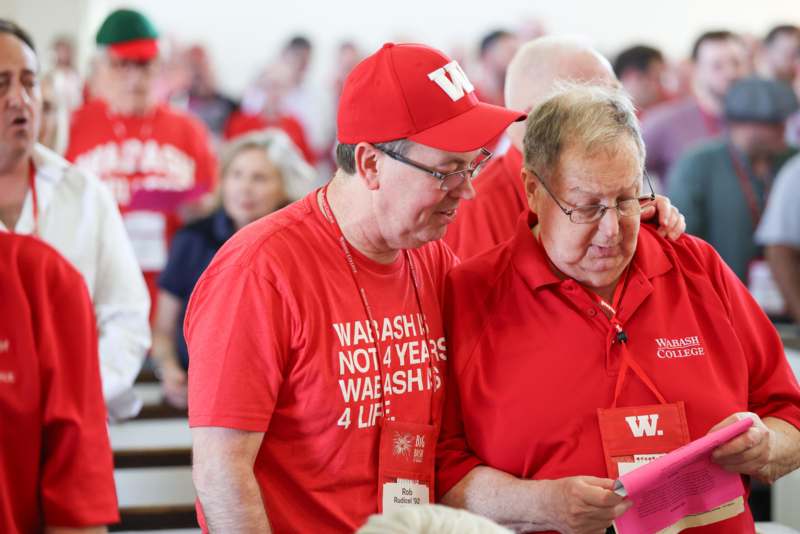 a group of men wearing red shirts