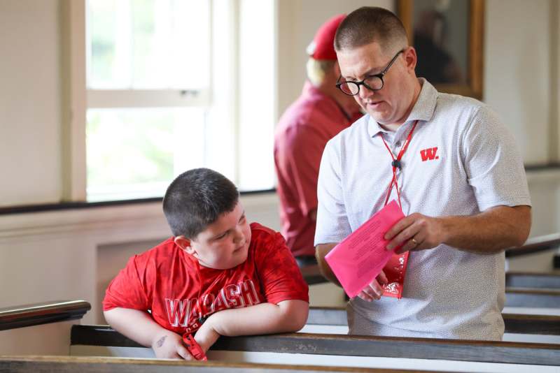 a man and boy in a classroom