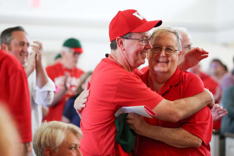 a group of men hugging