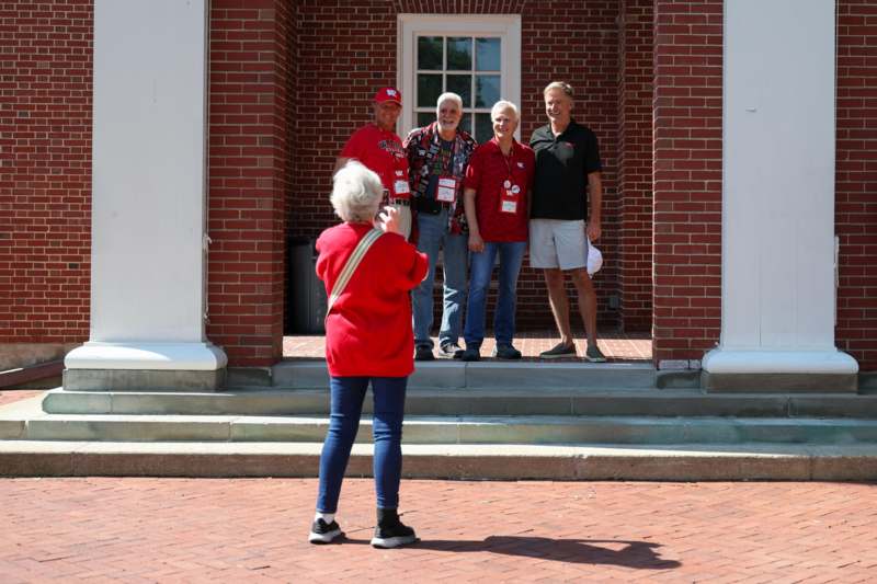 a group of people standing in front of a building