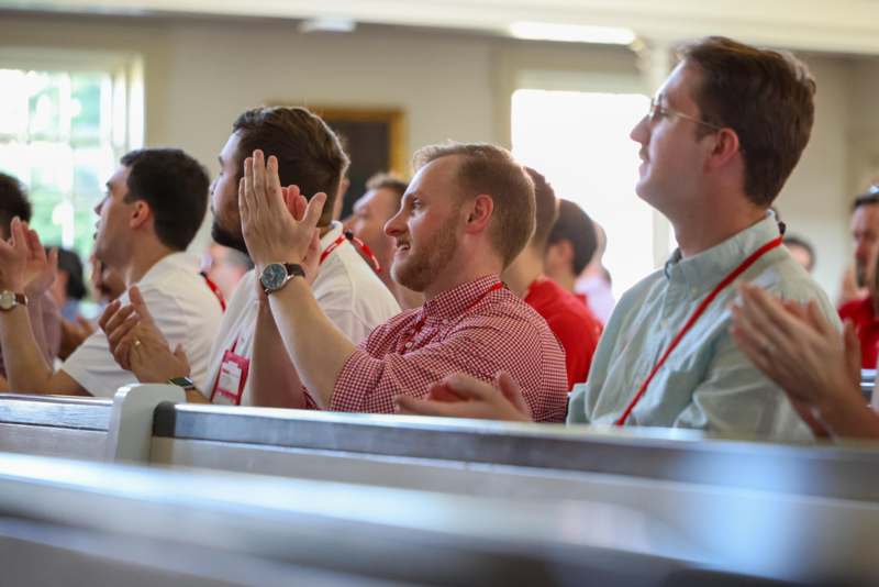 a group of people clapping