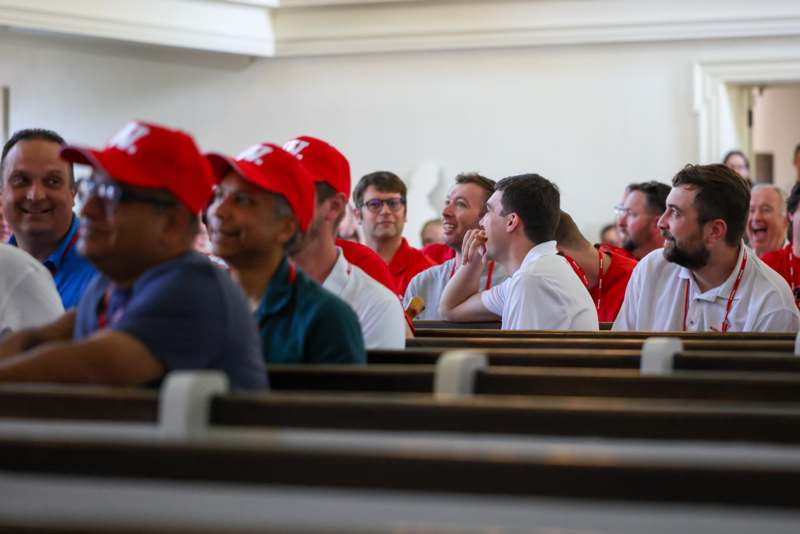 a group of people sitting in a church