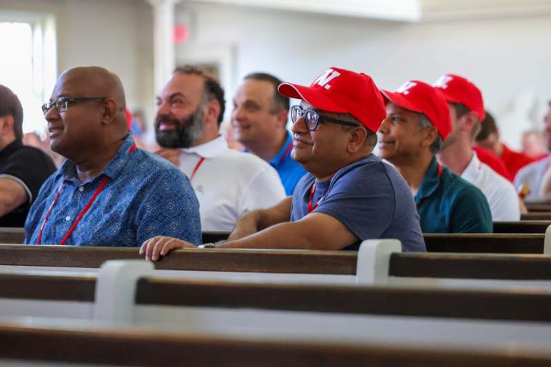 a group of people sitting in a church