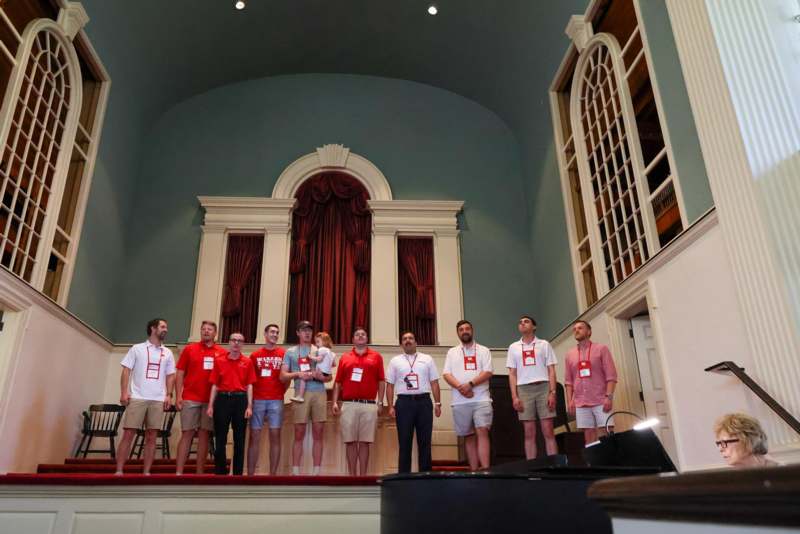 a group of people standing on a stage