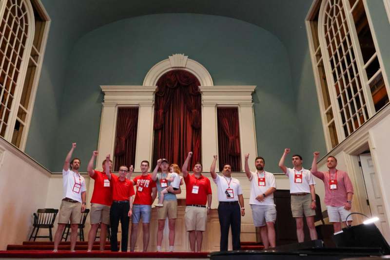 a group of people standing on a stage