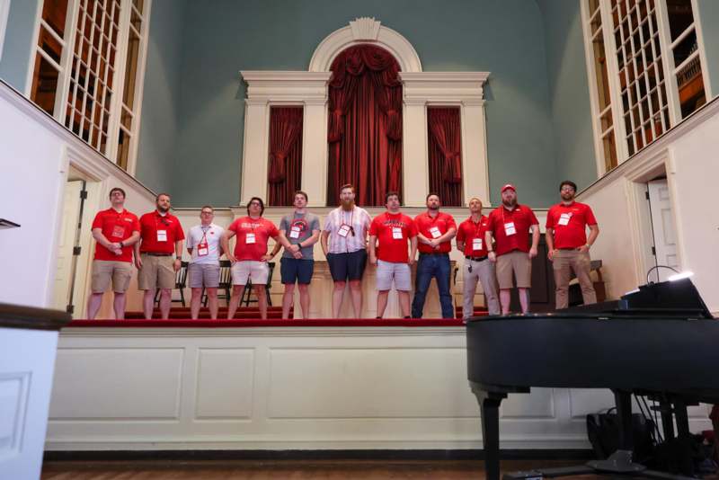 a group of people standing on a stage