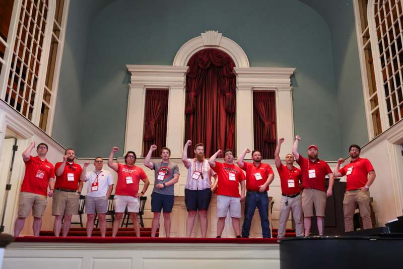 a group of people standing on a stage
