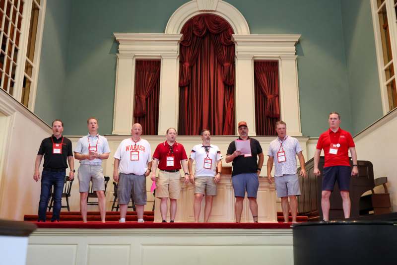 a group of people standing on a stage
