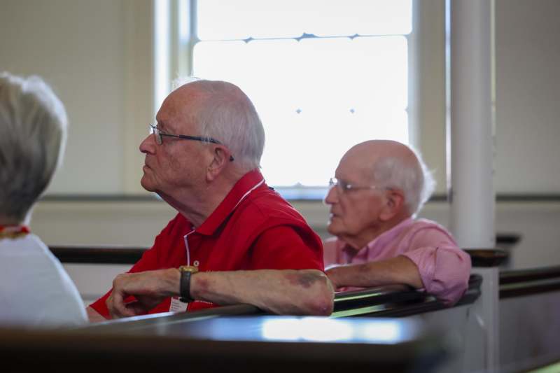 two old men sitting in a room