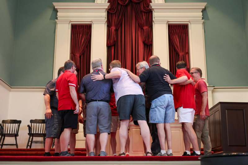 a group of people standing on a stage