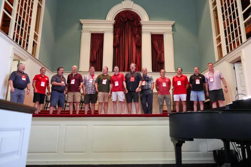 a group of people standing on a stage