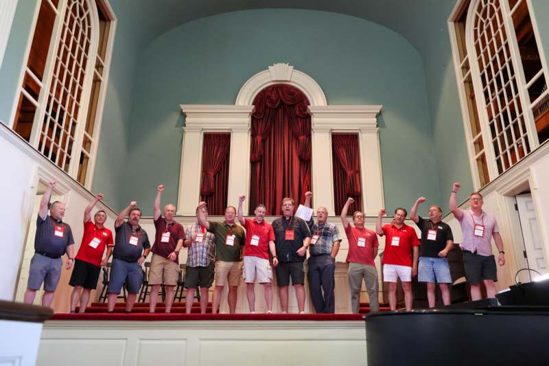 a group of people standing on a staircase