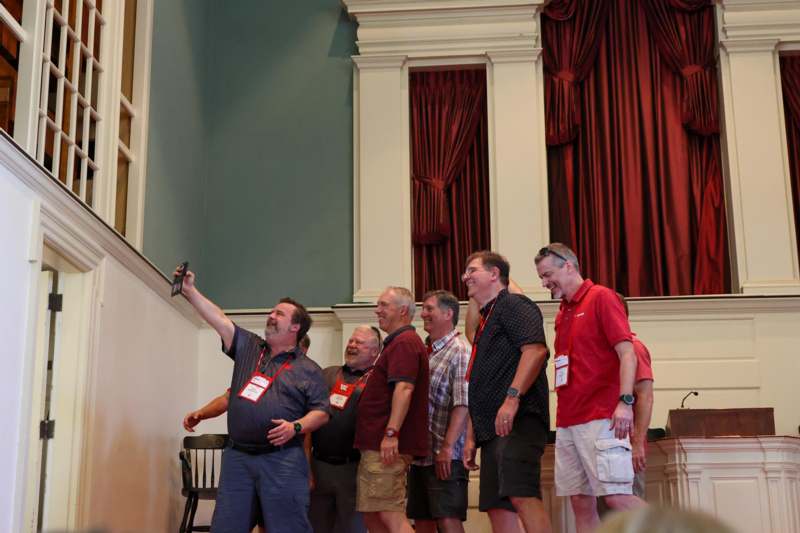 a group of men standing in a line