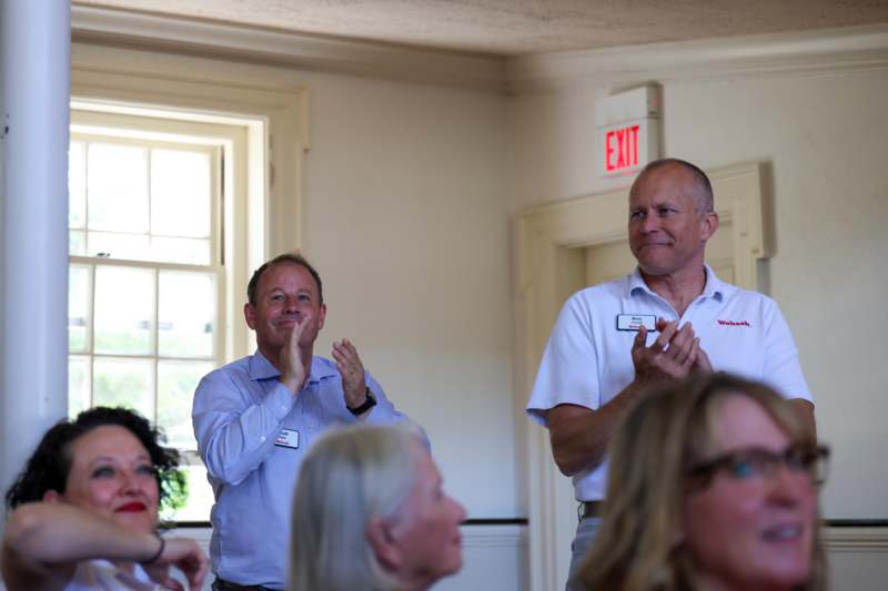 a group of people clapping