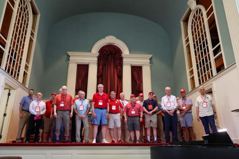 a group of people standing on a stage
