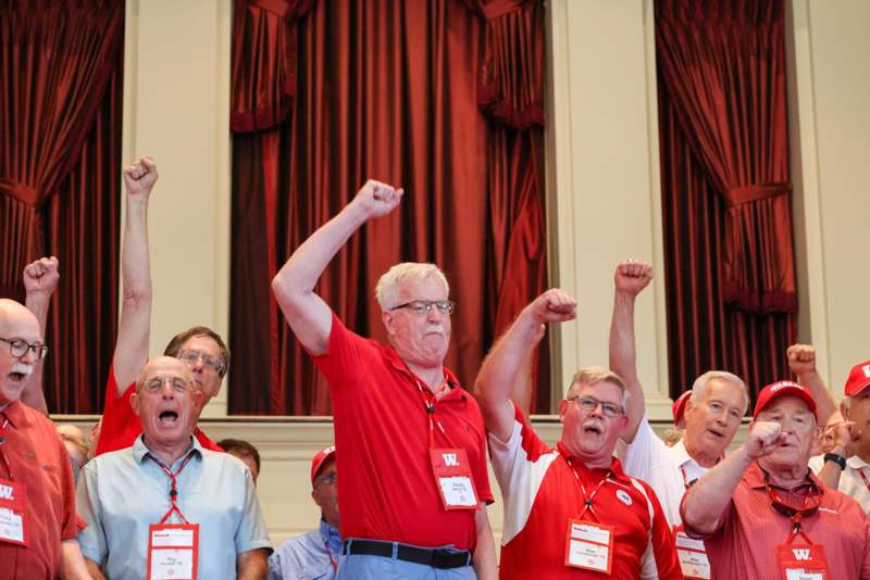 a group of men wearing matching shirts