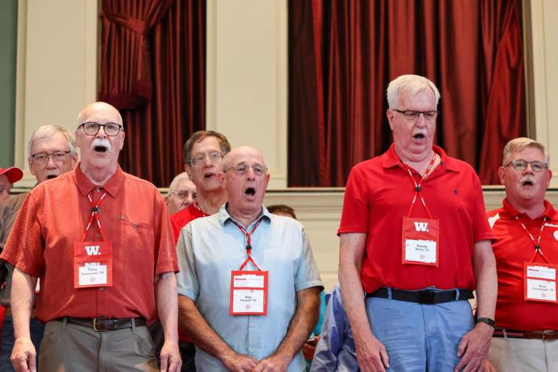 a group of men wearing lanyards