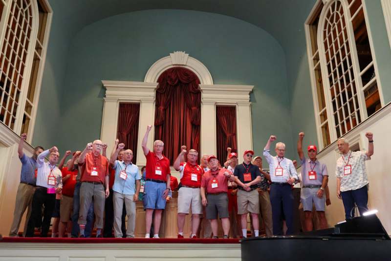 a group of people standing on a stage