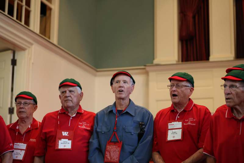 a group of men wearing matching outfits