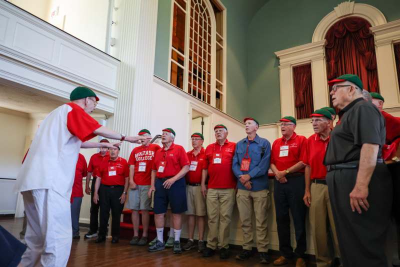 a group of men wearing matching outfits