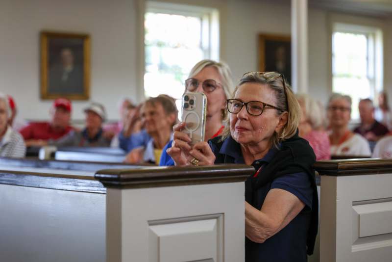 a woman taking a selfie with a phone