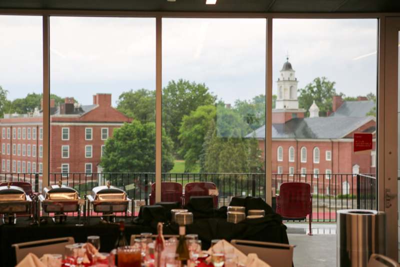 a room with a large window and a view of a building