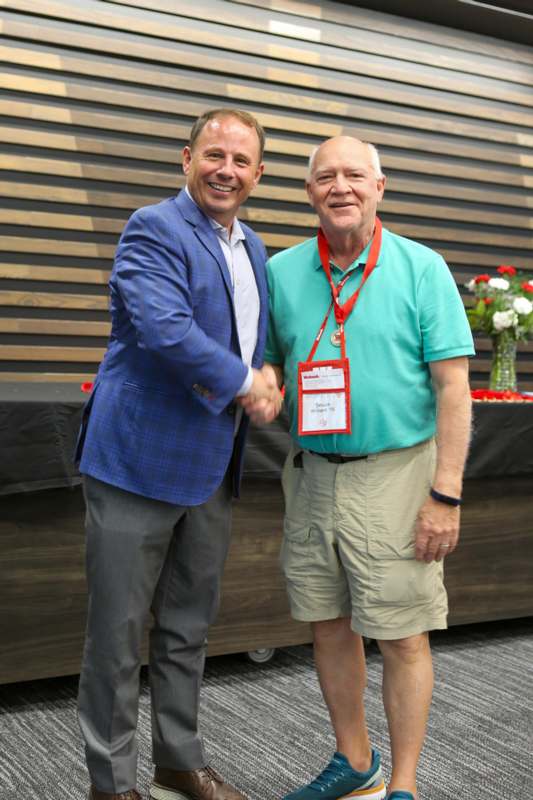a man shaking hands with another man