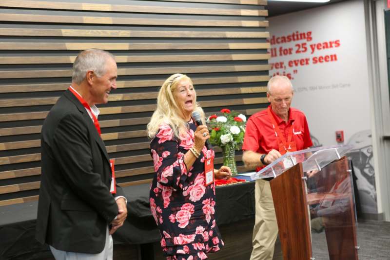 a woman speaking into a microphone