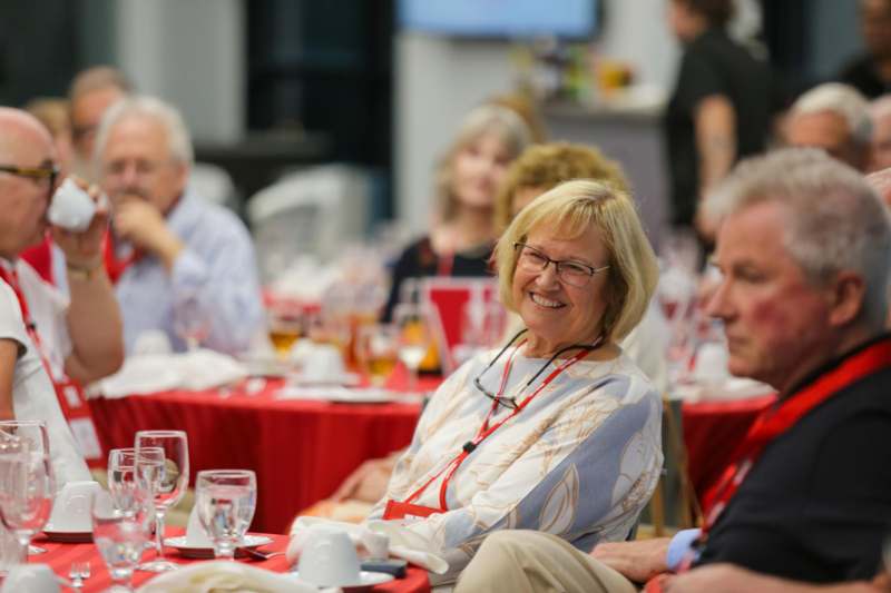 a group of people sitting at tables