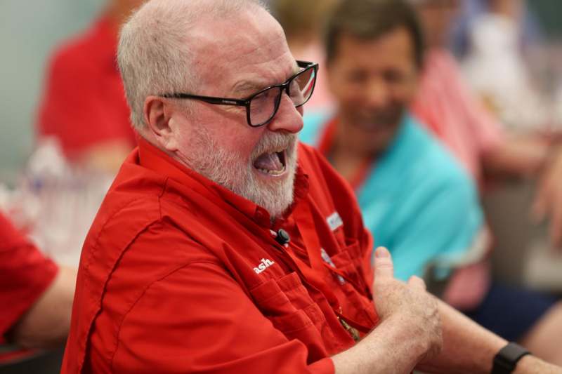 a man in glasses with his mouth open