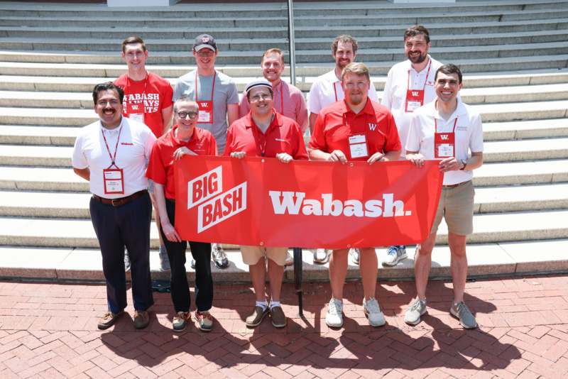 a group of men holding a banner