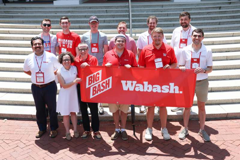 a group of people holding a banner