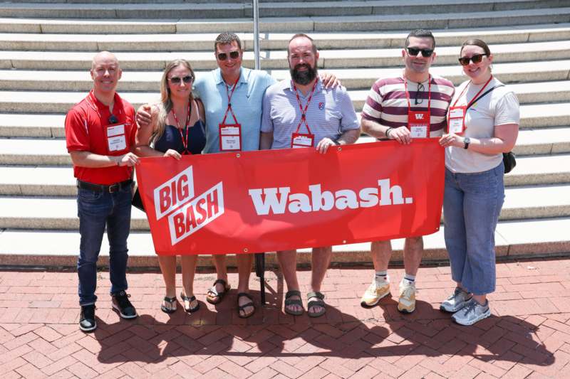 a group of people holding a banner