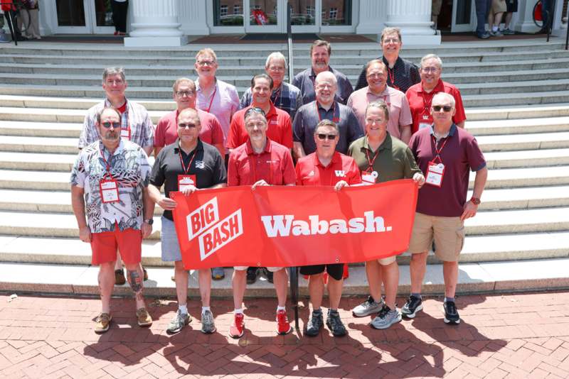 a group of people holding a banner