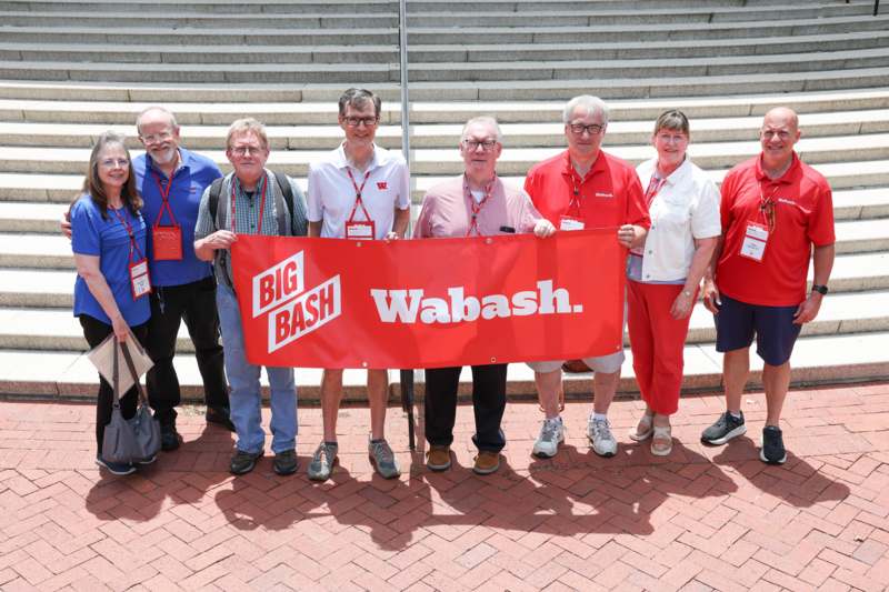 a group of people holding a banner