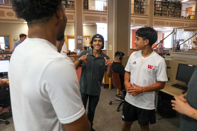 a group of men in a library