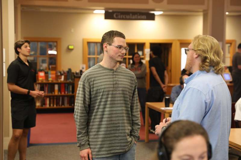 a group of people in a library