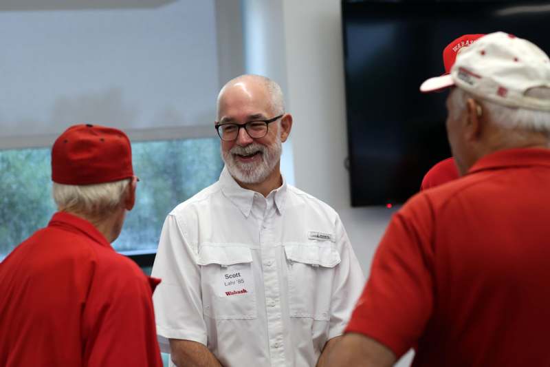 a group of men wearing red shirts