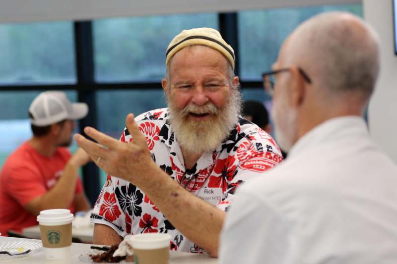 a man talking to another man