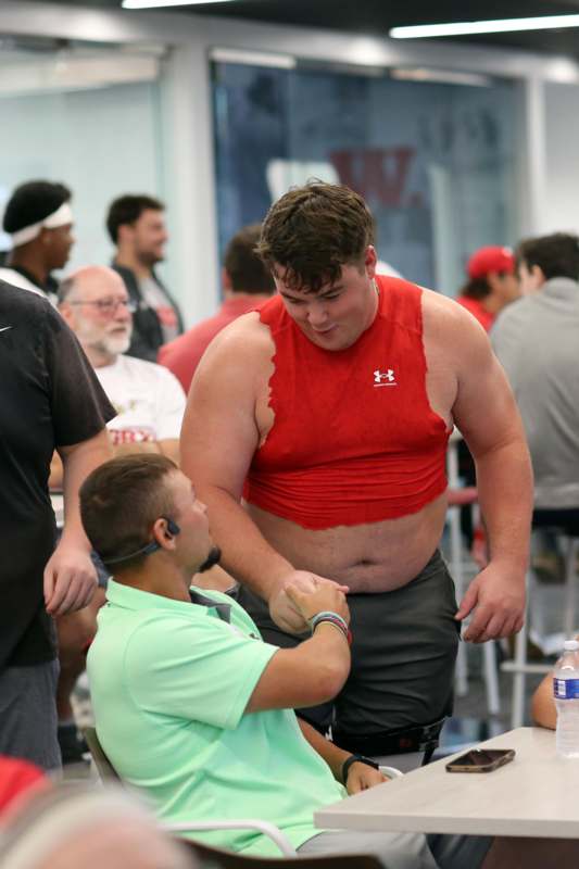 a man shaking hands with another man