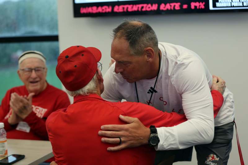 a man hugging another man
