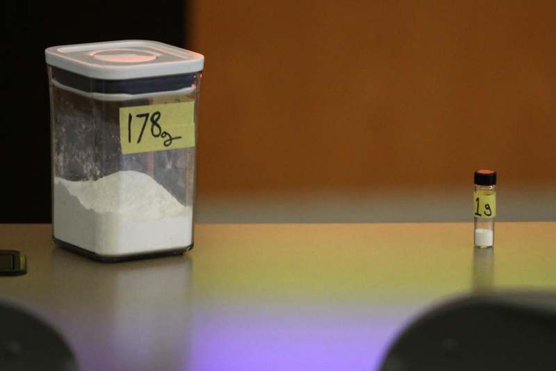a container with white powder on a counter