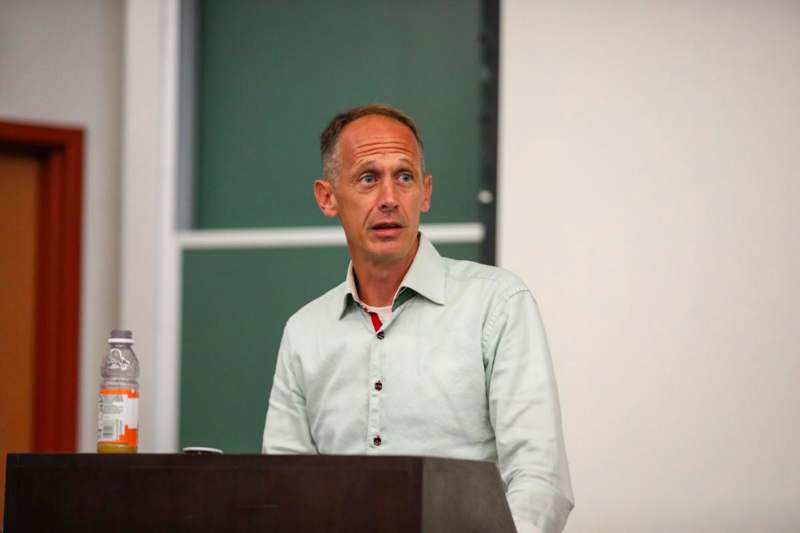 a man standing at a podium