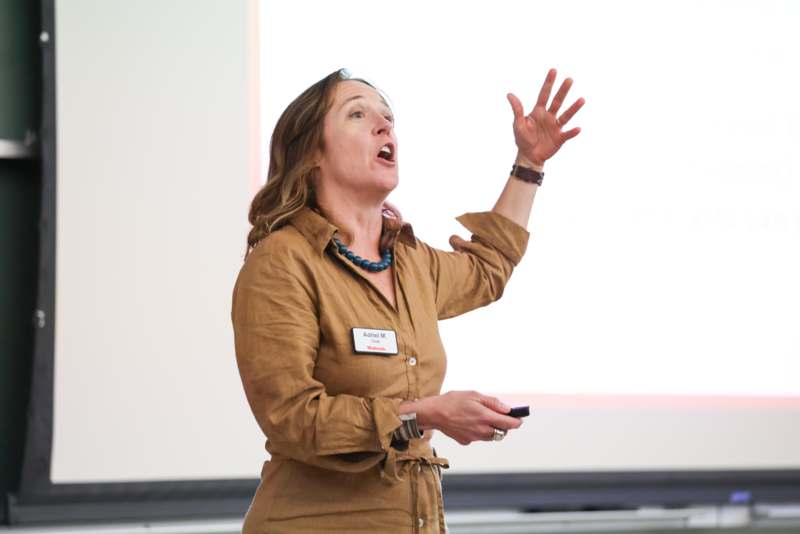 a woman in a brown shirt