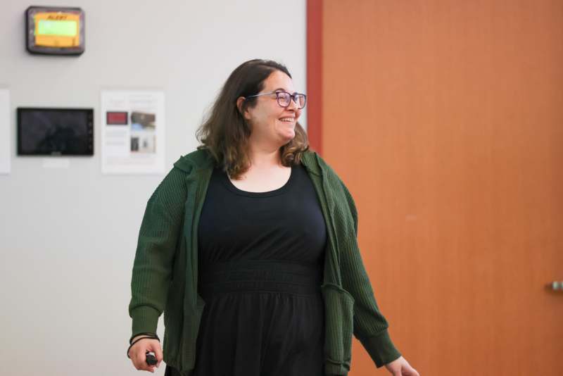 a woman smiling in a room