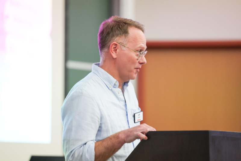 a man standing at a podium